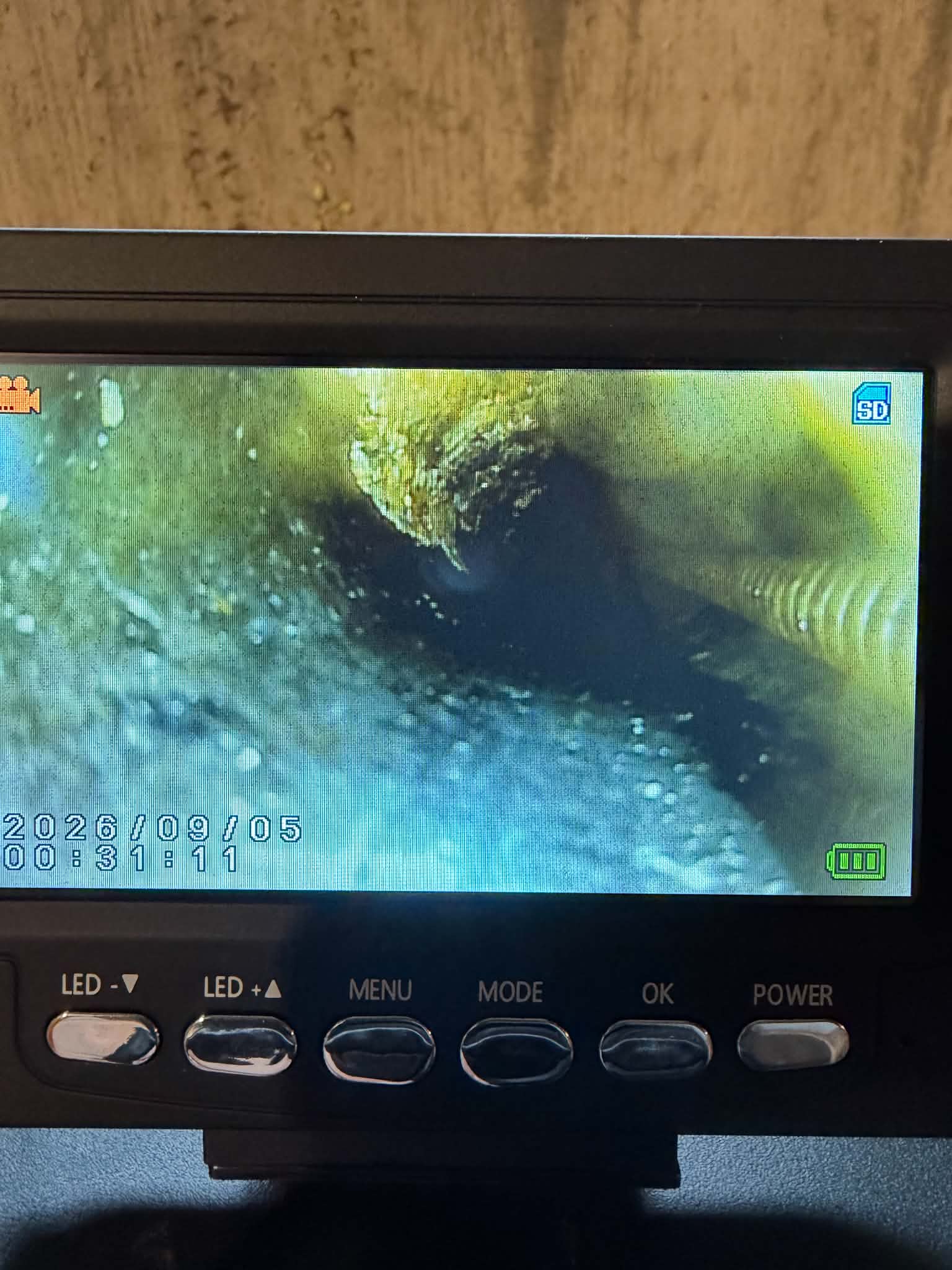 Drain camera showing the inside of a sewer line